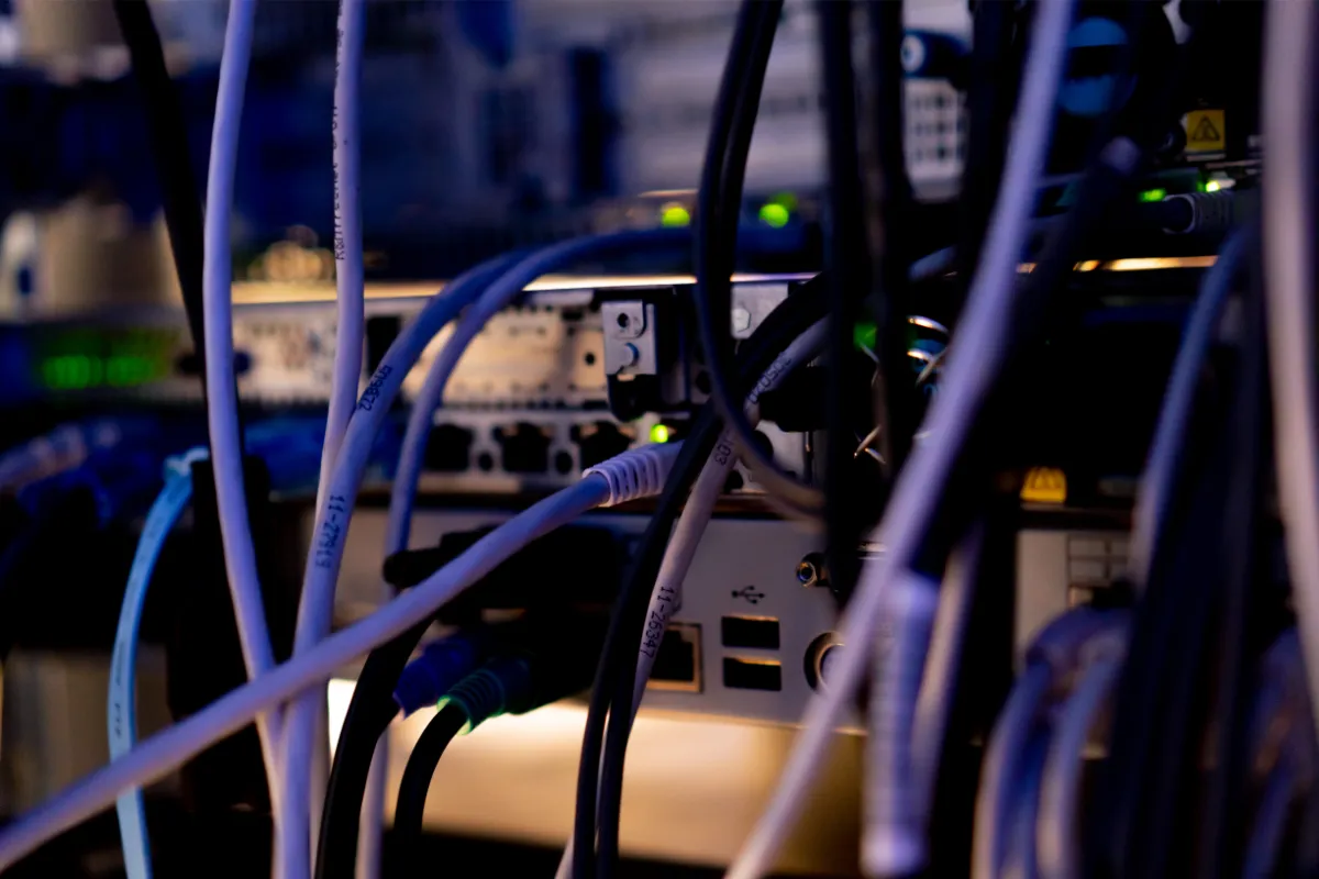 patch network cables sorted in a rack cabinet in a server rack